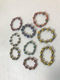 set of bracelets made from cardboard boxes, Haiti Creates